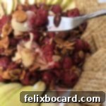 Baked Brie with sweet raspberry and crunchy almond topping