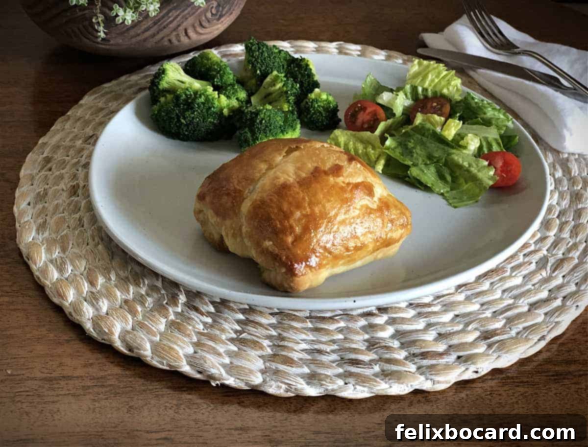 Puff Pastry on a plate with broccoli and a small salad