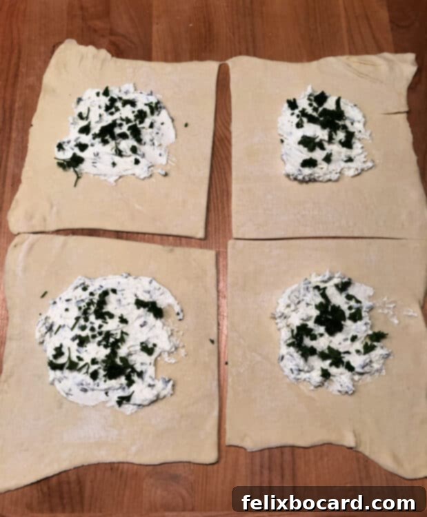 cream cheese and parsley added to each pastry square