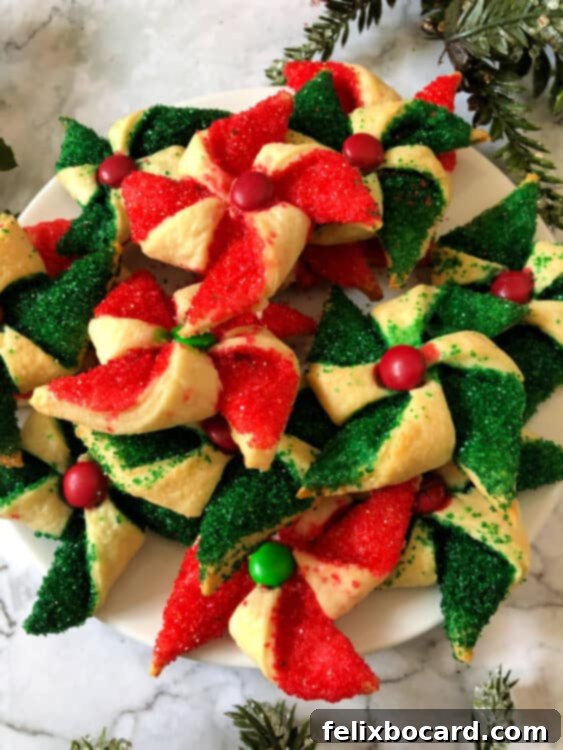 plate full of green and red poinsettia cookies