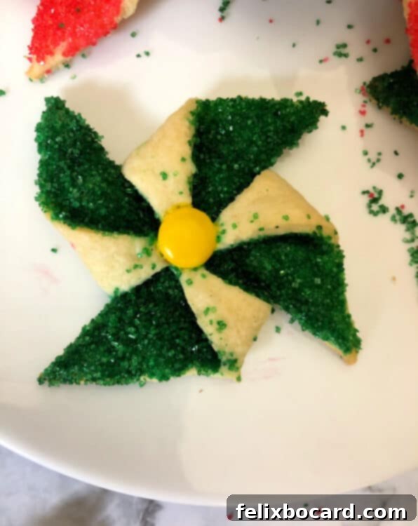 green poinsettia cookie with yellow M&M center