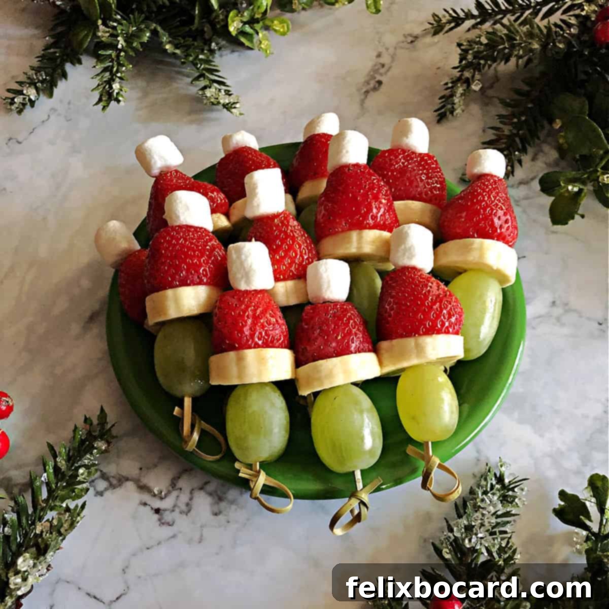 Grinch Fruit Skewers 2 Green plate of Grinch kabobs made of fruit, showcasing a vibrant and healthy Christmas appetizer.