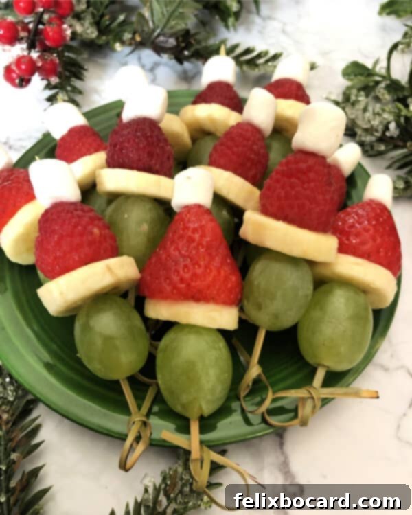 Grinch Fruit Skewers 3 Close-up of a festive holiday appetizer, showcasing the vibrant colors of Grinch fruit kabobs.