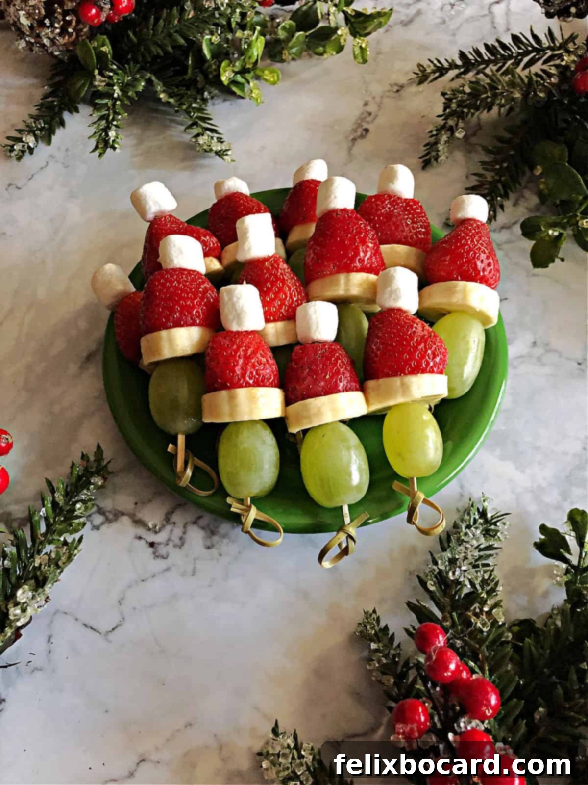 Grinch Fruit Skewers 5 Plate of fresh Grinch fruit kabobs ready to be served at a holiday party.