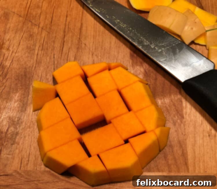 Golden Butternut Squash Chowder 5 Peeled and cubed pieces of butternut squash, ready for cooking.