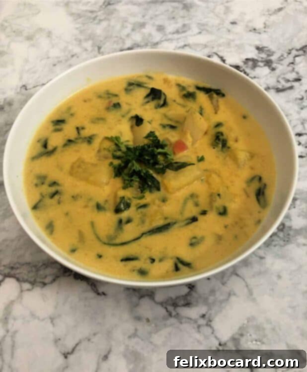 Golden Butternut Squash Chowder 7 A steaming bowl of Butternut Squash Chowder with a creamy texture.