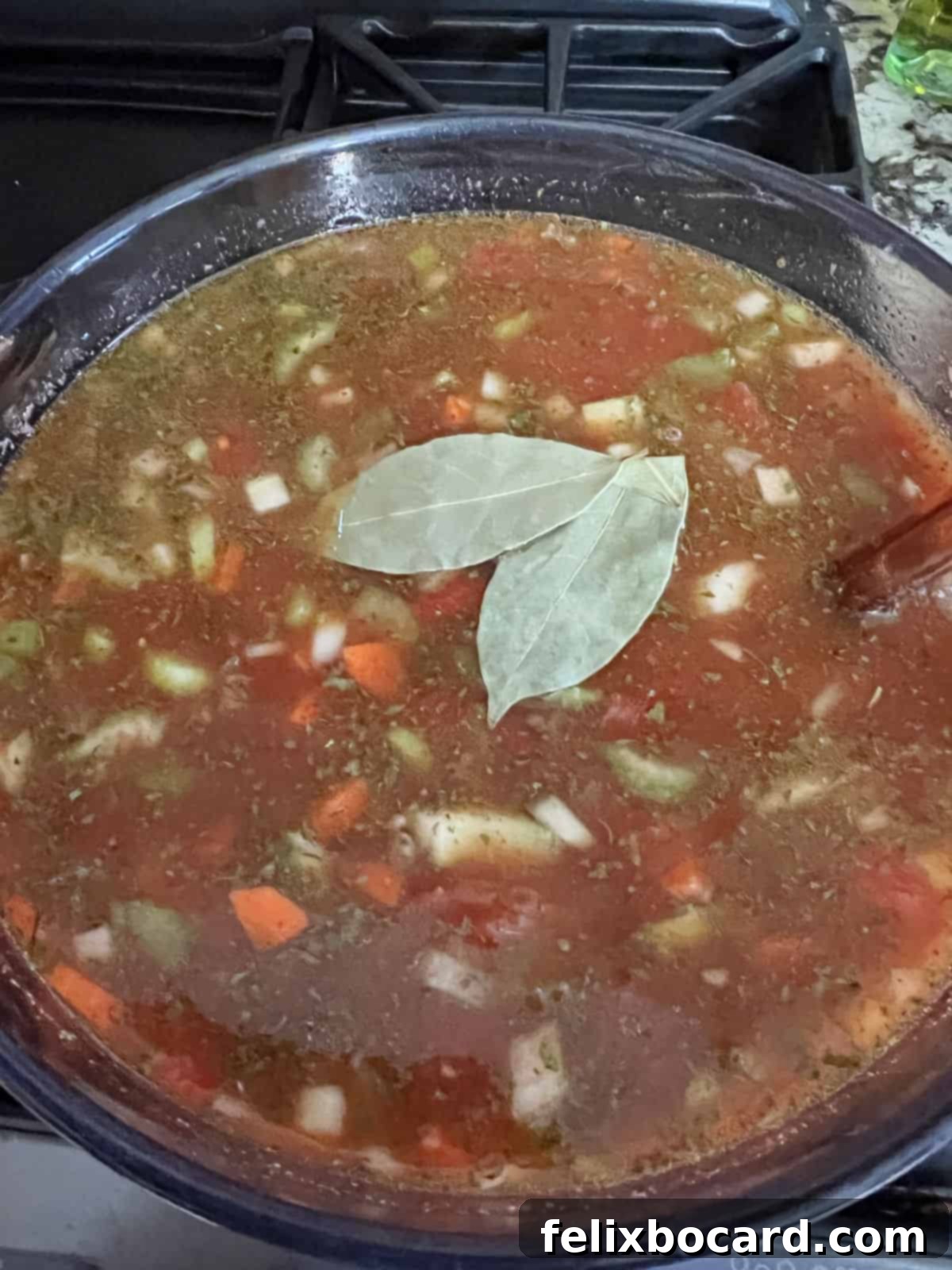 Ground Beef Barley Soup 6 All the soup ingredients, including beef broth, diced tomatoes, V8 juice, and spices, combined in a large pot and ready to simmer.