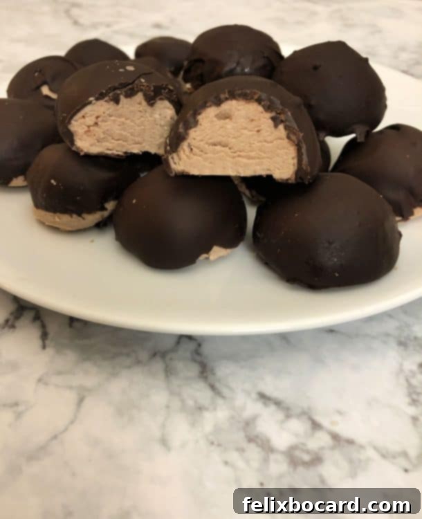Decadent Keto Chocolate Cheesecake Bites 3 plate of chocolate cheesecake fat bombs, one cut open