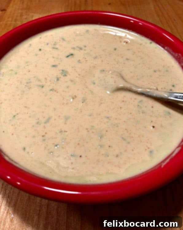Smooth cashew crema mixed in a red bowl, ready for vegan cauliflower tacos