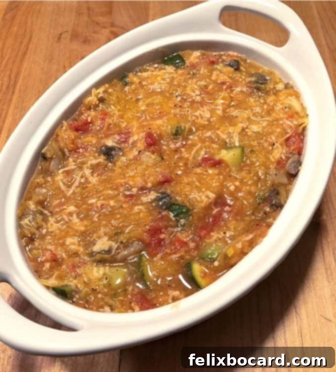 Garden Veggie Spaghetti Squash Bake 3 Ingredients mixed in a white casserole dish, ready to be baked