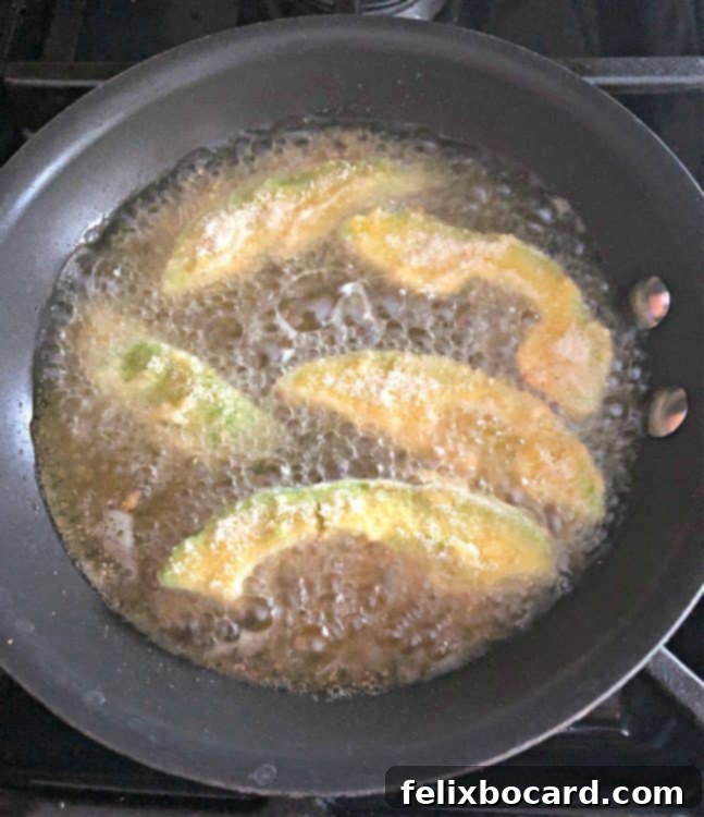 avocado slices frying in oil