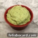 Avocado Cream sauce in a red bowl