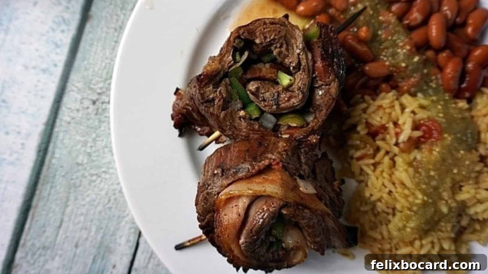 Grilled Flank Steak Stuffed Pinwheels, perfect for tailgating with savory fillings rolled in marinated flank steak.