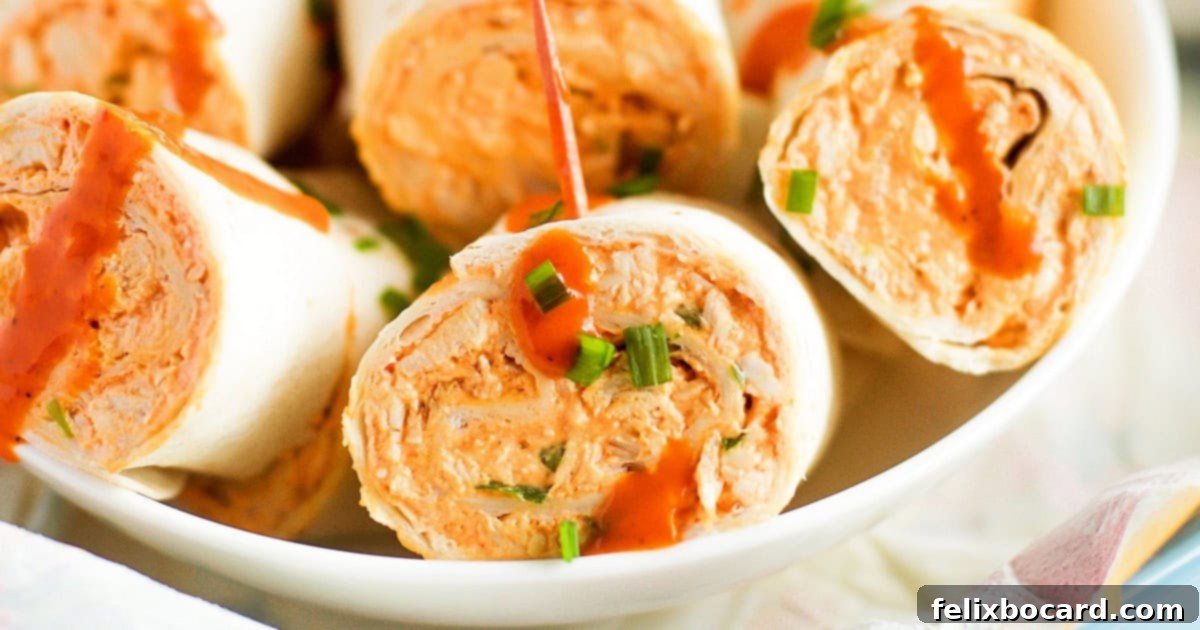 Buffalo Chicken Pinwheels, a spicy and easy appetizer with shredded chicken, buffalo sauce, and cream cheese.