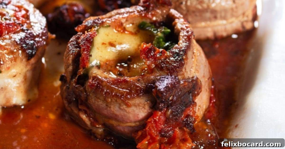 Italian Steak Pinwheels Roll Ups featuring tender flank steak, fresh basil, sun-dried tomatoes, and mozzarella cheese.