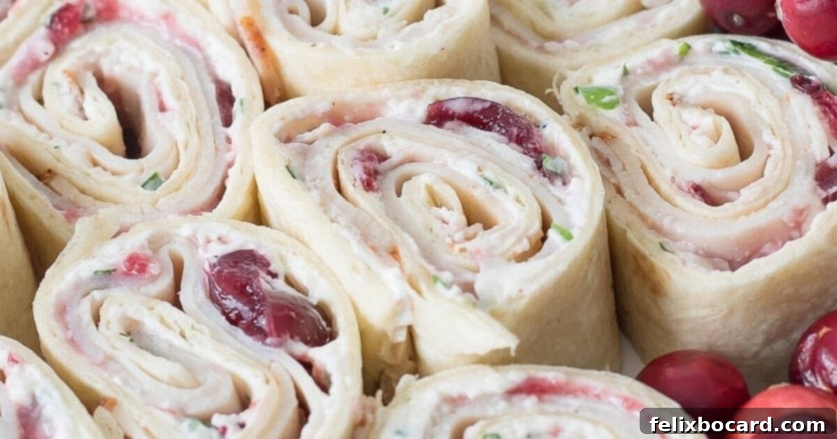 Cranberry Turkey Pinwheels, a perfect holiday appetizer with cranberry sauce, Cajun turkey, and scallion cream cheese in tortillas.
