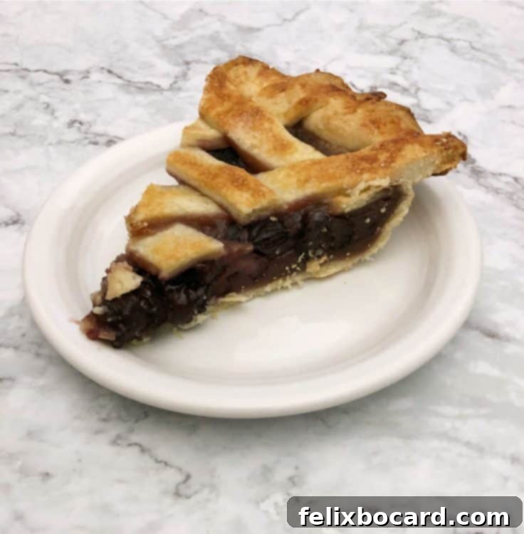 slice of cherry pie on a white plate