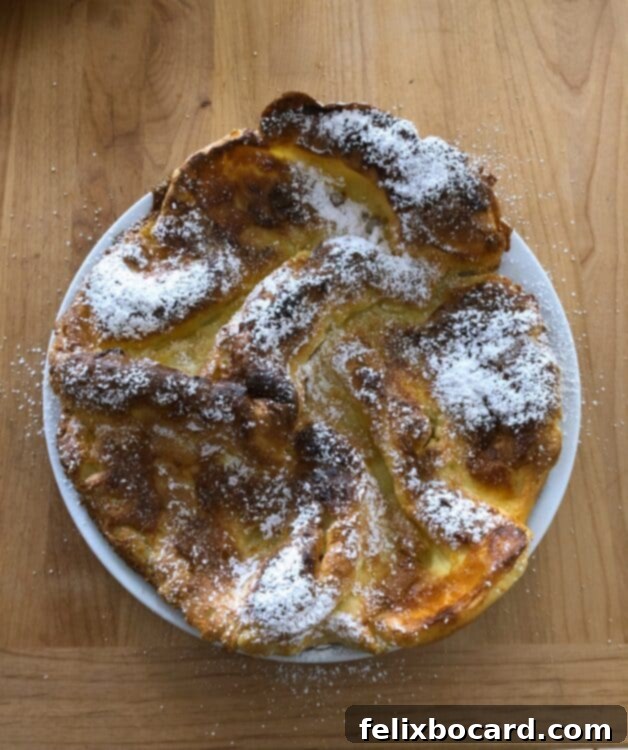 Dutch Baby with a squeeze of lemon and powdered sugar