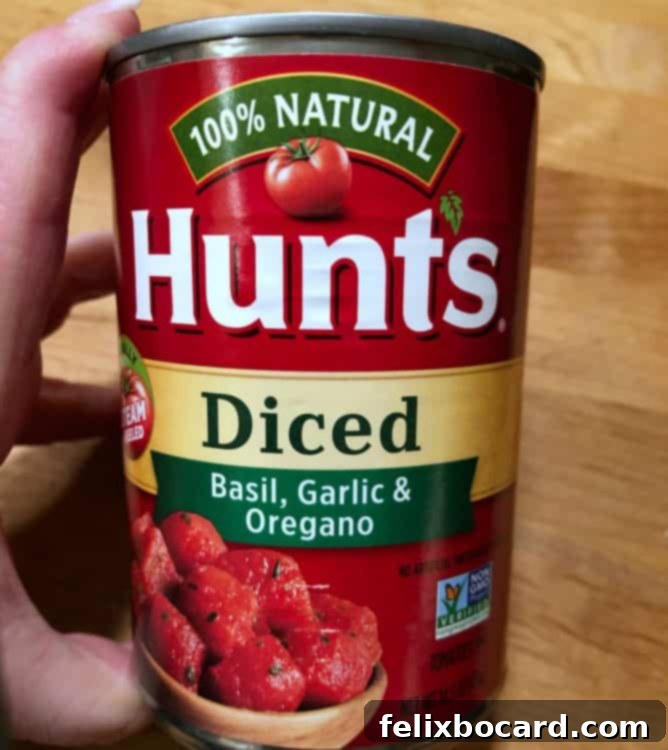 Weeknight Jambalaya 3 can of diced tomatoes, showing the label 'Italian diced tomatoes'.