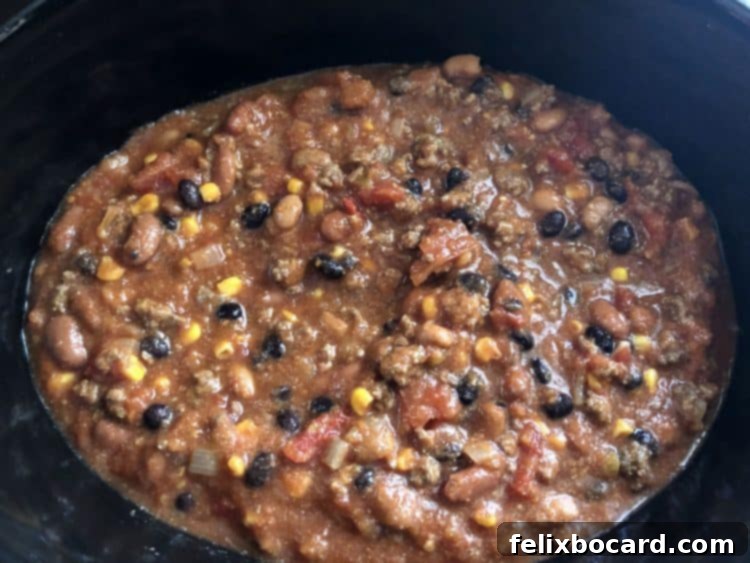 ingredients added to crock pot, ready to slow cook