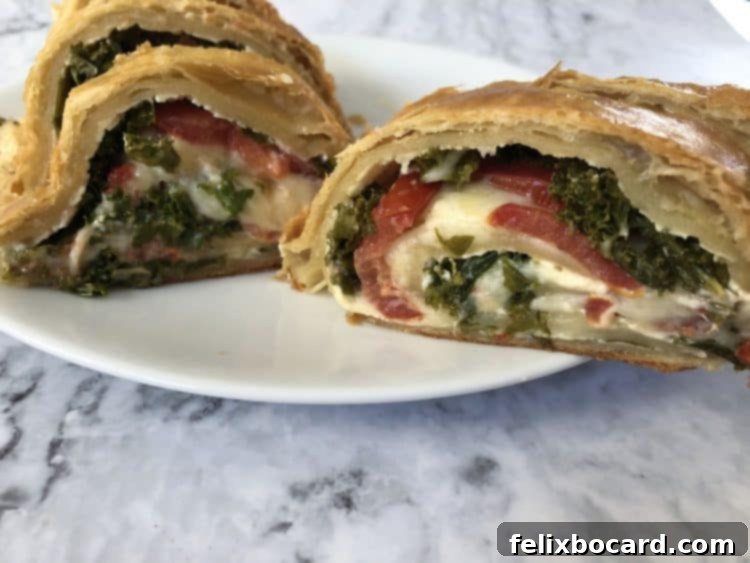 Slices of puff pastry Stromboli arranged on a white plate