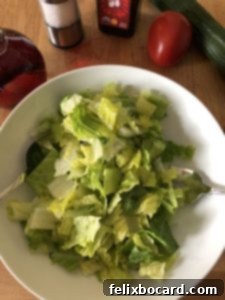 salad greens in a white bowl