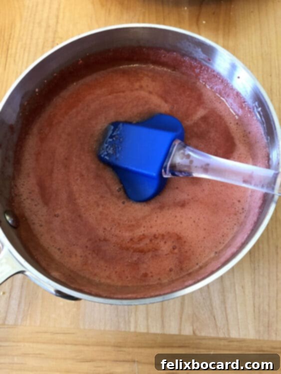 Jam-Filled Doughnut Bake 2 Strawberry cake filling simmering in a small saucepan