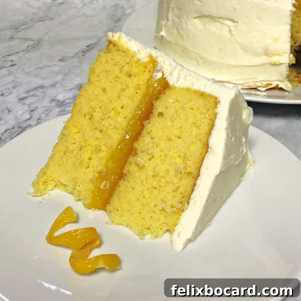 A beautiful slice of Lemon Layer Cake on a plate, showcasing its distinct layers of moist cake, tangy lemon curd, and fluffy lemon-cream cheese frosting.