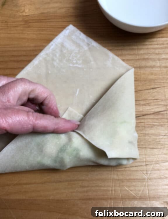 first side of wrapper folded in