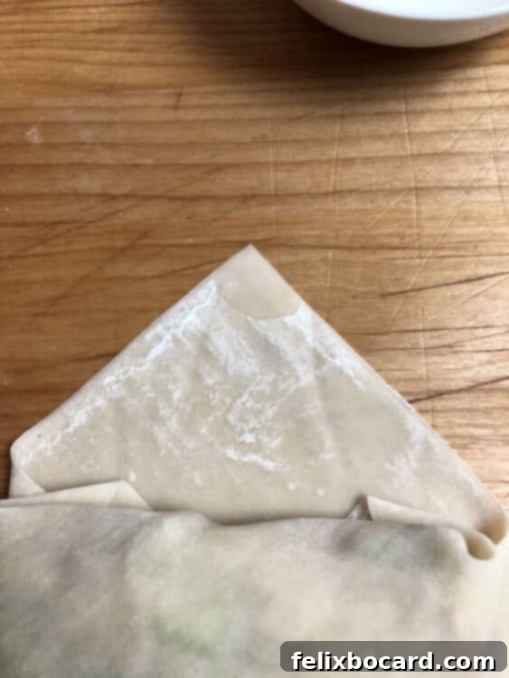 point of unwrapeped portion moistened with water