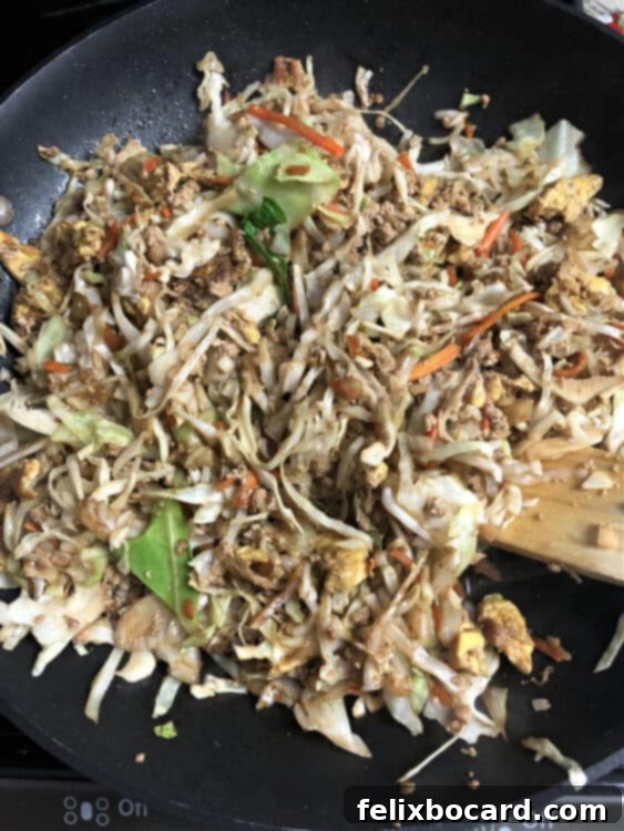 Unwrapped Veggie Egg Roll Bowl 4 Cole slaw mix added to skillet