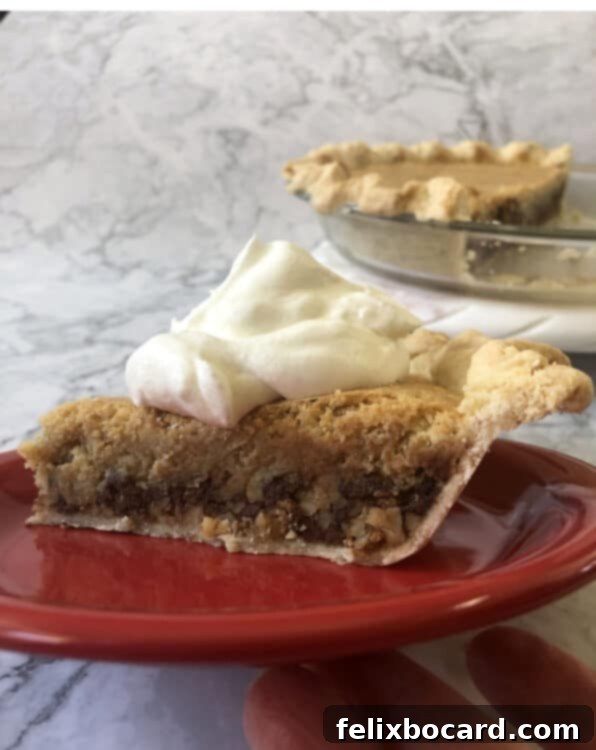 A sumptuous slice of Chocolate Walnut Pie, topped with a generous swirl of whipped cream, elegantly presented on a vibrant red plate.