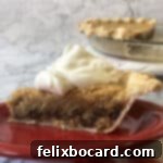 A tempting slice of Chocolate Walnut Pie, garnished with whipped cream, on a red plate.
