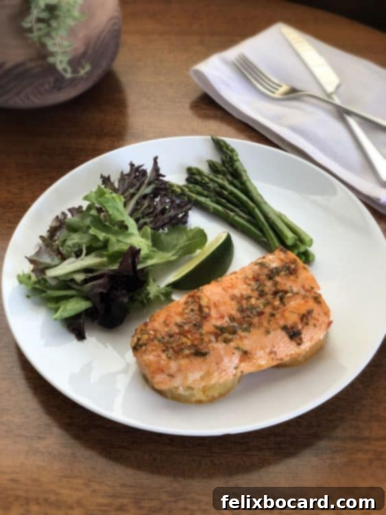 Baked Pineapple Salmon served with a fresh salad and asparagus