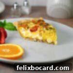 Slice of Caprese quiche on a plate, ready to eat.