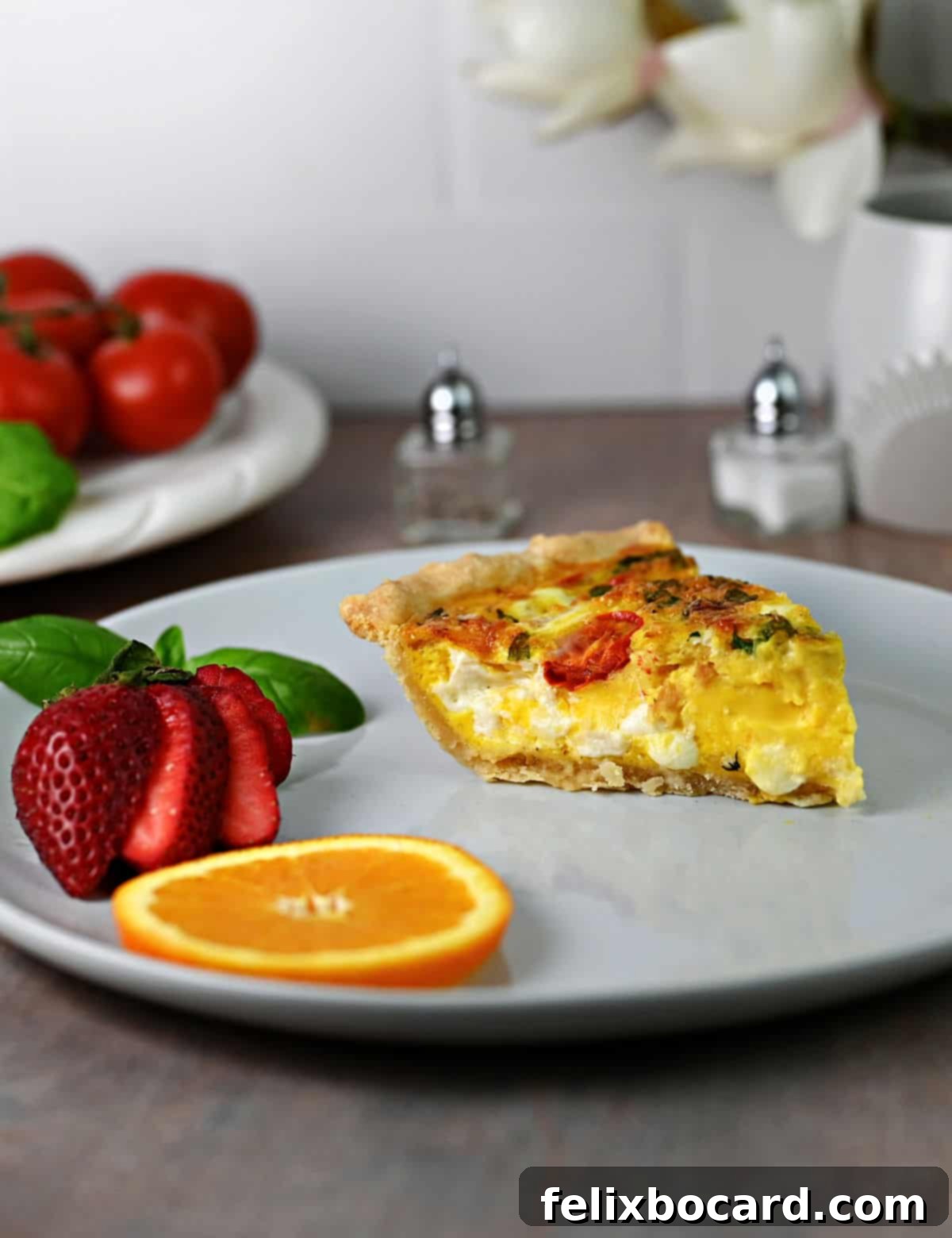 A slice of quiche ready to eat.