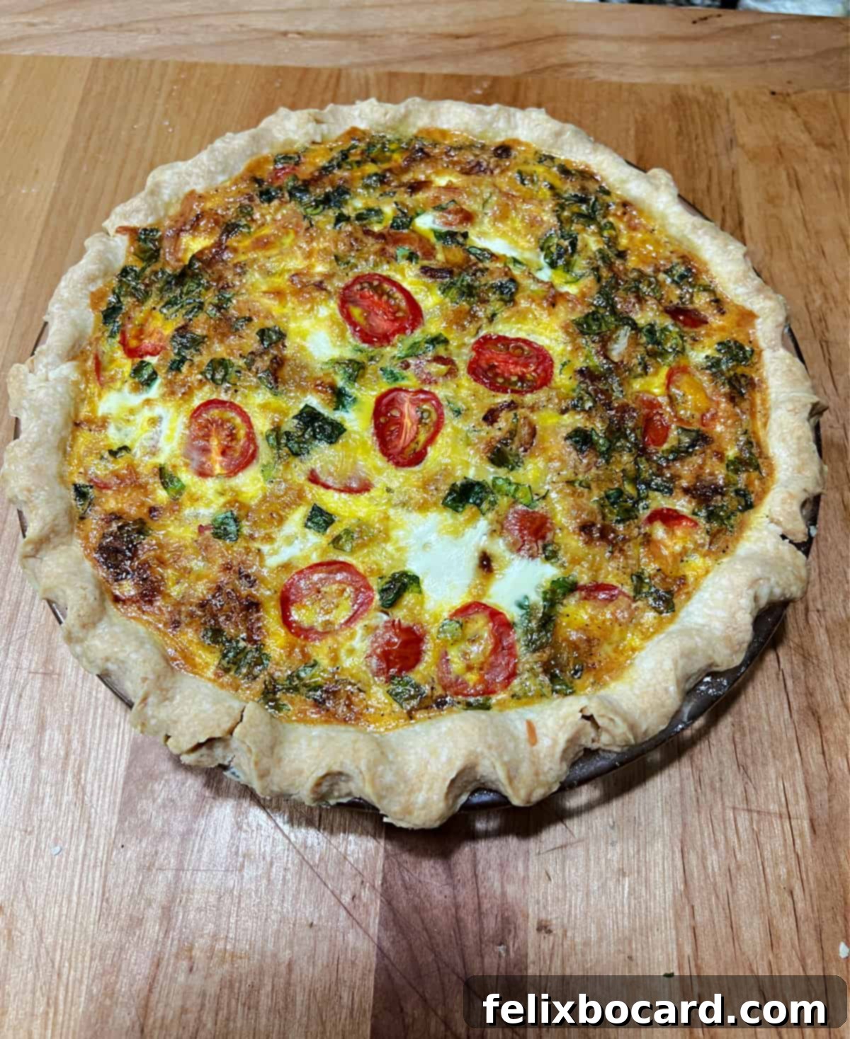 Whole baked Caprese quiche.