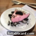 pink koolaid pie on a white plate