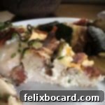 hasselback chicken cut to show the layers