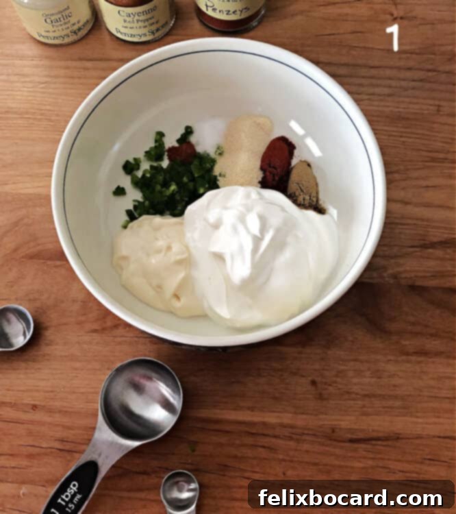 Copycat Taco Bell Creamy Jalapeno Quesadilla Sauce 3 Bowl containing all the pre-measured ingredients for the creamy jalapeño sauce, ready to be mixed.