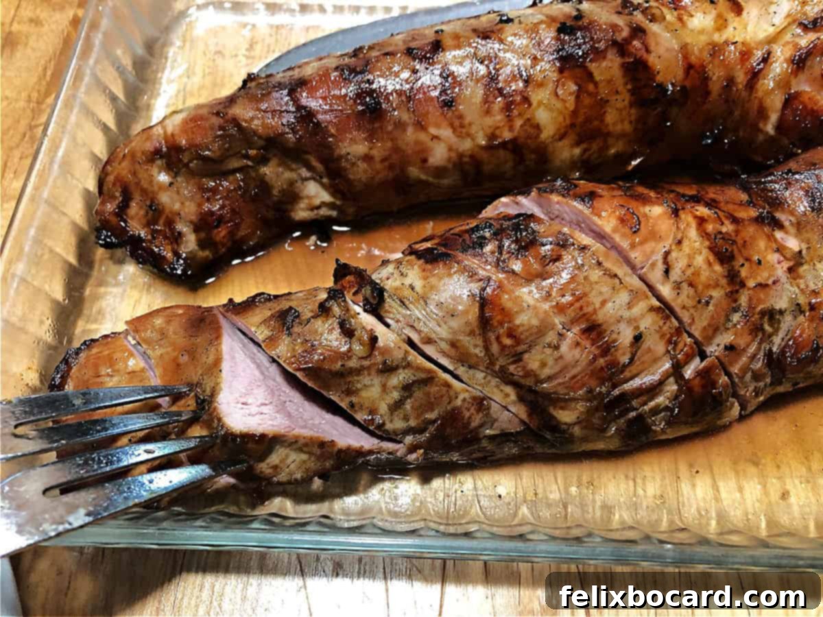 Succulent Grilled Pork Tenderloin 2 Grilled pork tenderloin sliced in a glass pan