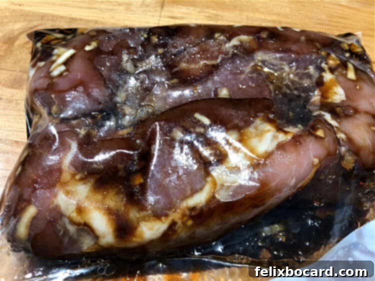 Succulent Grilled Pork Tenderloin 3 meat marinating in a bag