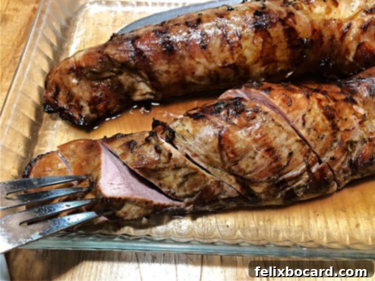 Succulent Grilled Pork Tenderloin 6 Grilled pork tenderloin sliced in a glass pan