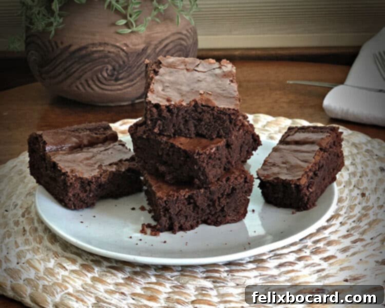 stack of brownies on a small white plate