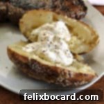 baked potato from the grill served on a white plate