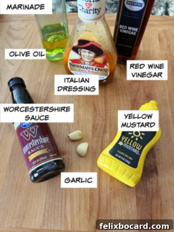 Ingredients for the best beef kabob marinade including olive oil, Italian dressing, red wine vinegar, yellow mustard, Worcestershire sauce, and fresh garlic.