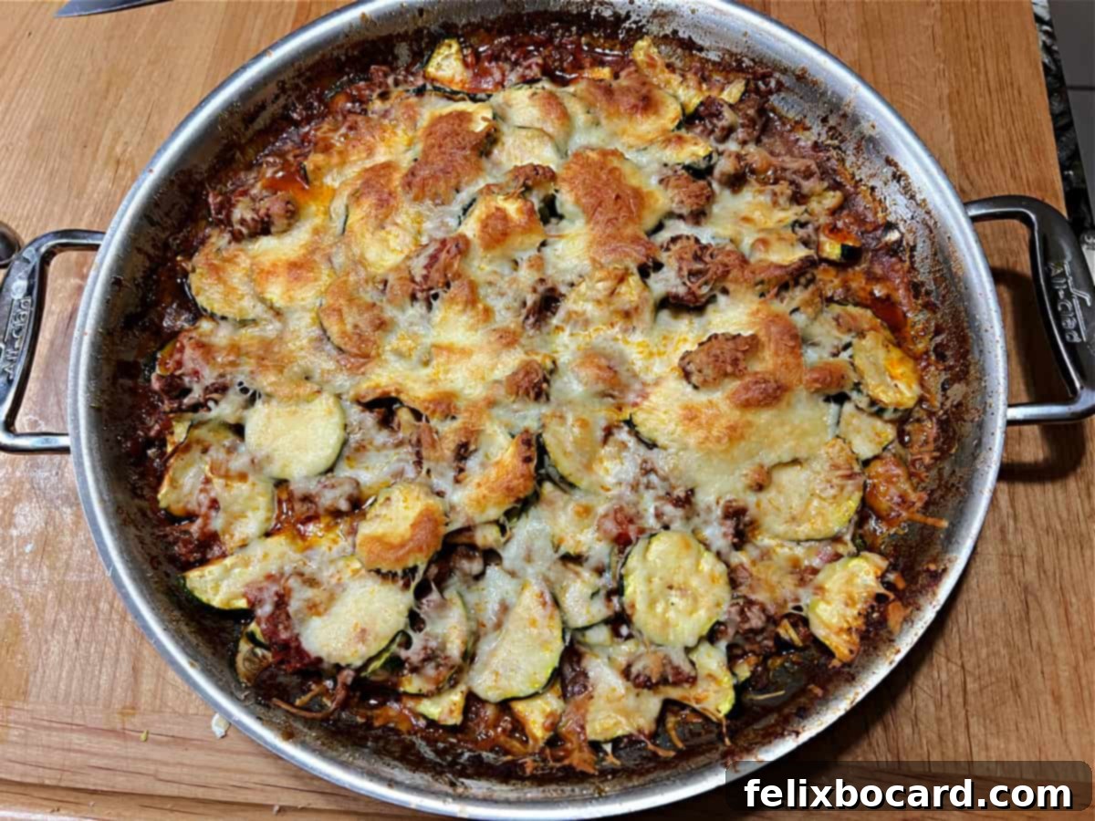 The delicious zucchini casserole, perfectly baked and served directly in a skillet, highlighting convenience and rustic appeal.