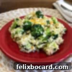 Guilt Free Cheesy Cauliflower Rice 6 Cauliflower rice with broccoli and cheese in a small bowl