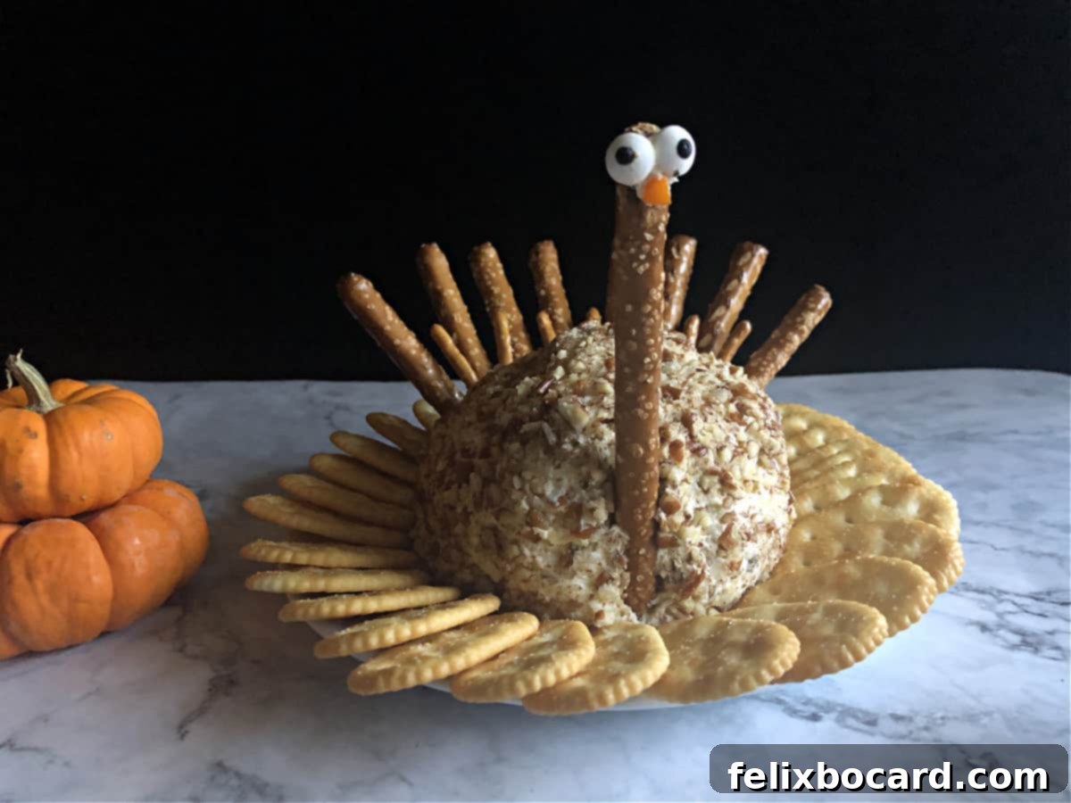 A festive turkey cheese ball, beautifully decorated and ready to serve at Thanksgiving.