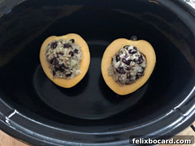 uncooked halves of stuffed squash in a slow cooker